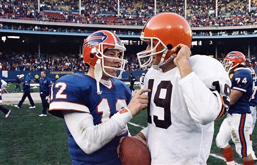 Photo of Cleveland Browns quarterback Bernie Kosar with Buffalo Bills quarterback Jim Kelly. 