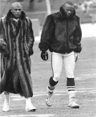 Photo of Cleveland Browns players Frank Minnifield and Hanford Dixon leaving the field in style. 