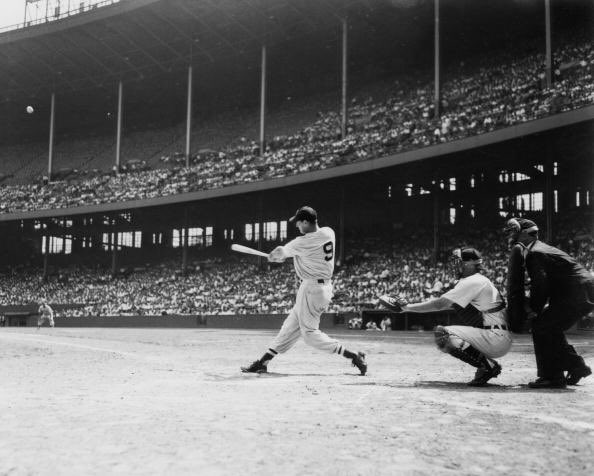 Photo of Ted Williams of the Boston Red Sox hitting a home run vs. the Cleveland Indians at Cleveland Municipal Stadium.