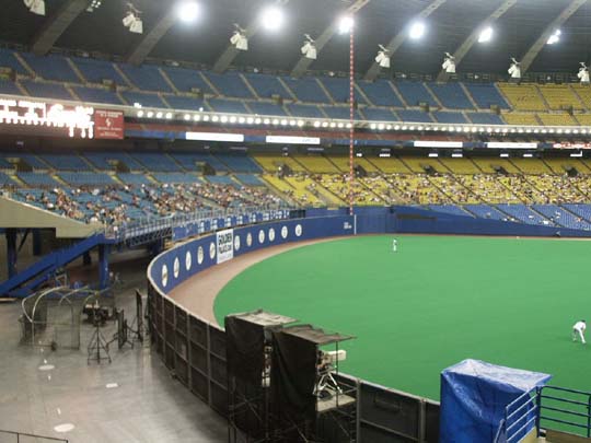 Photo of the playing field from behind the home run wall at Olympic Stadium.