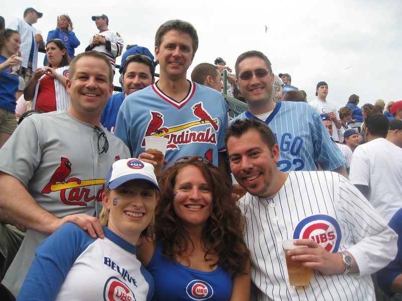 Photo of baseball fans taking a group photo at Wrigley Field in Chicago, Illinois.