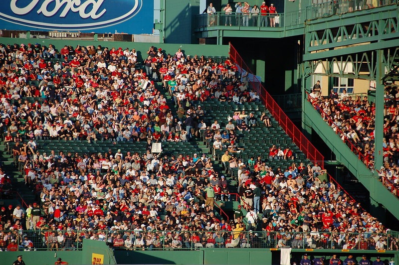Photo of Boston Red Sox fans seated in the Fenway Park bleachers.