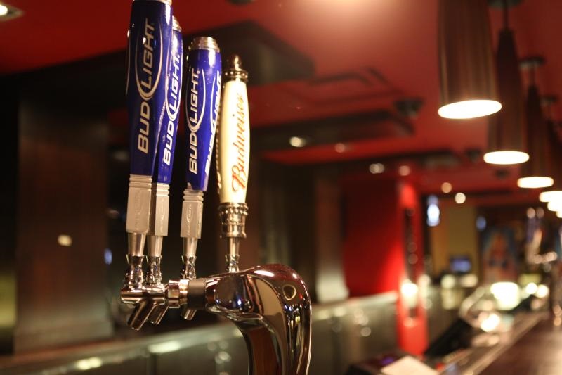Photo of Budweiser beer taps at an arena.