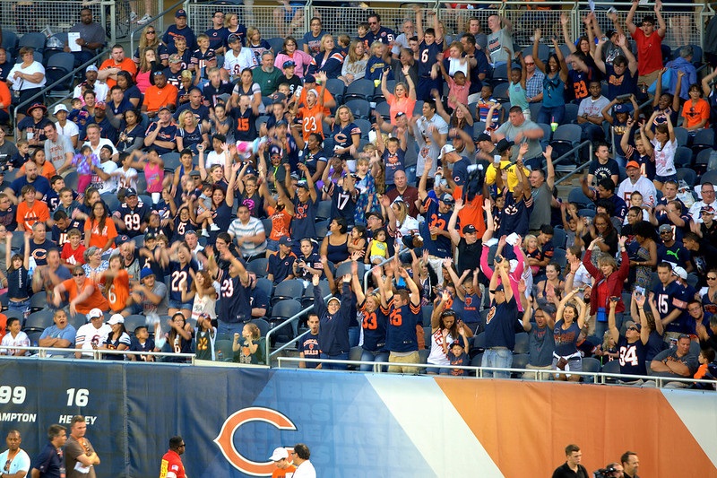 Photo of Chicago Bears fans cheering at Soldier Field during a Chicago Bears home game.