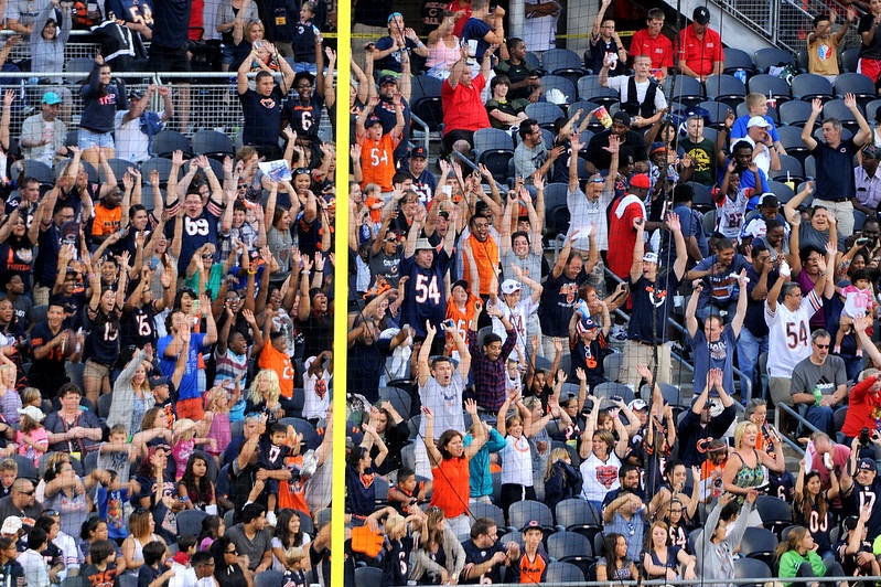 Photo of Chicago Bears fans cheering at Soldier Field.