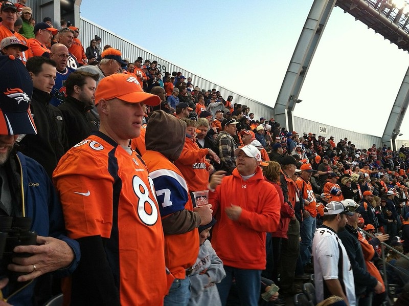 Photo of Denver Broncos fans cheering at Sports Authority Field at Mile High.
