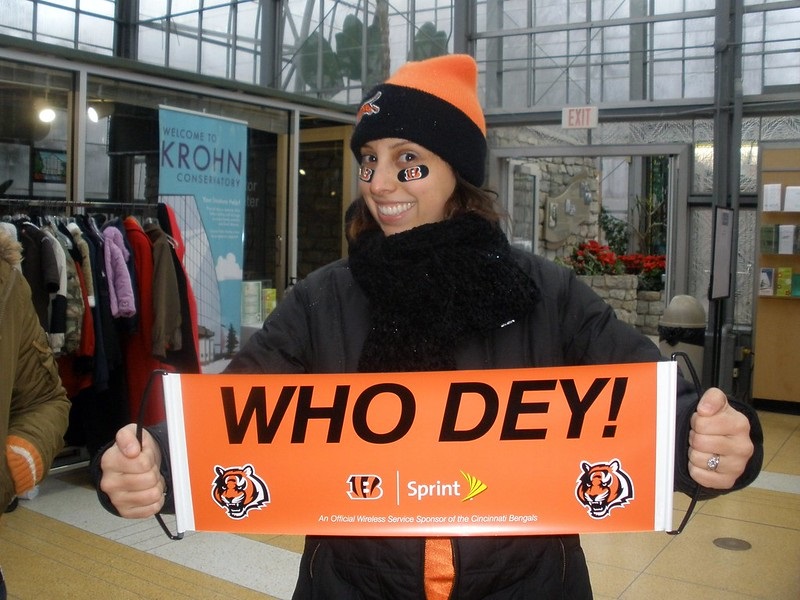 Photo of a female Cincinnati Bengals fan holding up a Who Dey sign.