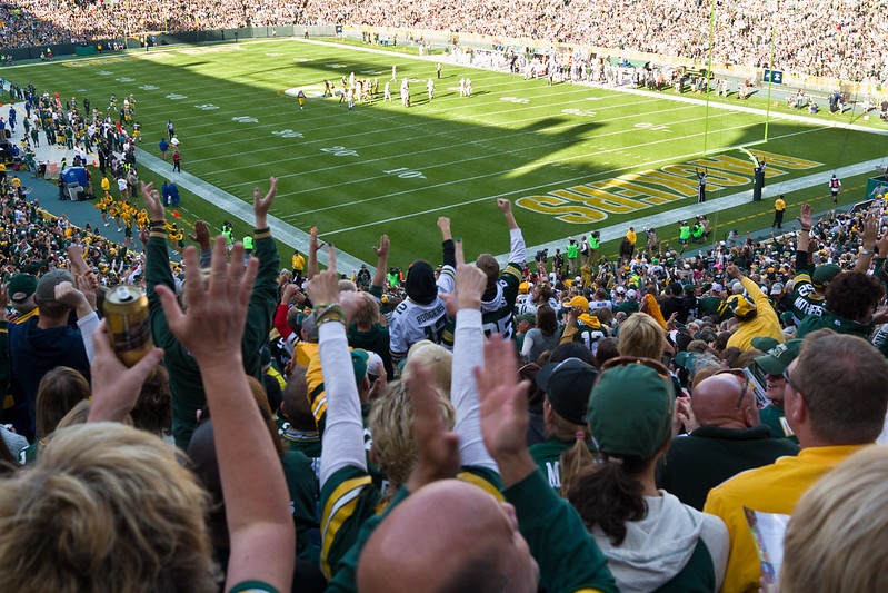 Photo of Green Bay Packers fans cheering at Lambeau Field.