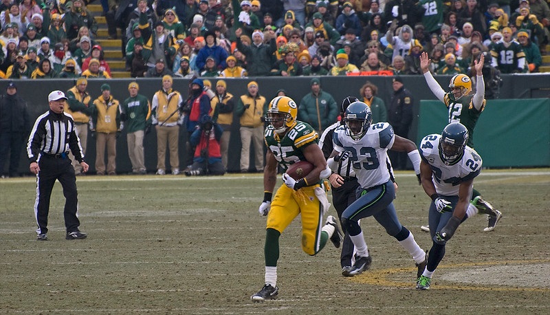 Photo of Ryan Grant of the Green Bay Packers scoring a touchdown versus the Seattle Seahawks at Lambeau Field.