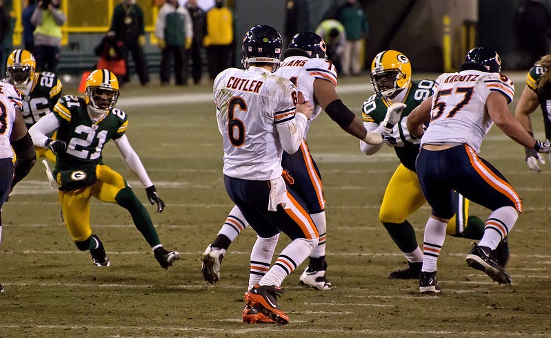 Photo of Jay Cutler of the Chicago Bears dropping back to complete a pass versus the Green Bay Packers.