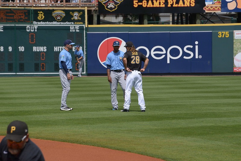 Photo of John Jaso of the Pittsburgh Pirates speaking with former teammates on the Tampa Bay Rays.