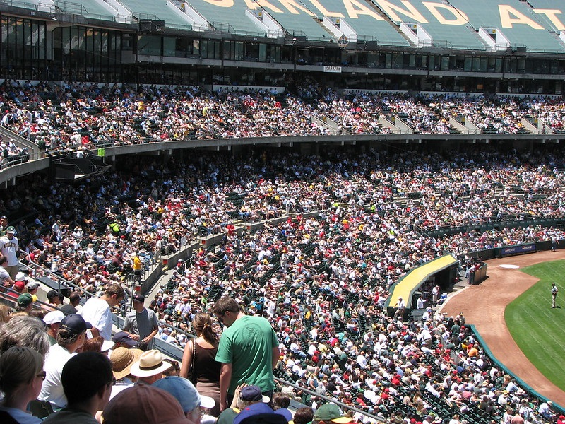 Photo of a large crowd at an Oakland Athletics game at Oakland Coliseum.