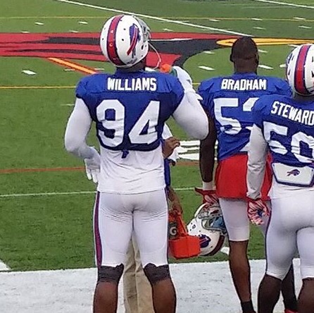 Photo of Mario Williams of the Buffalo Bills standing on the sidelines during a practice session.