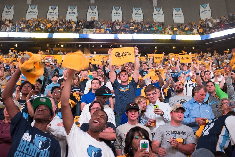 Photo of basketball fans cheering during a Memphis Grizzlies game at FedexForum.