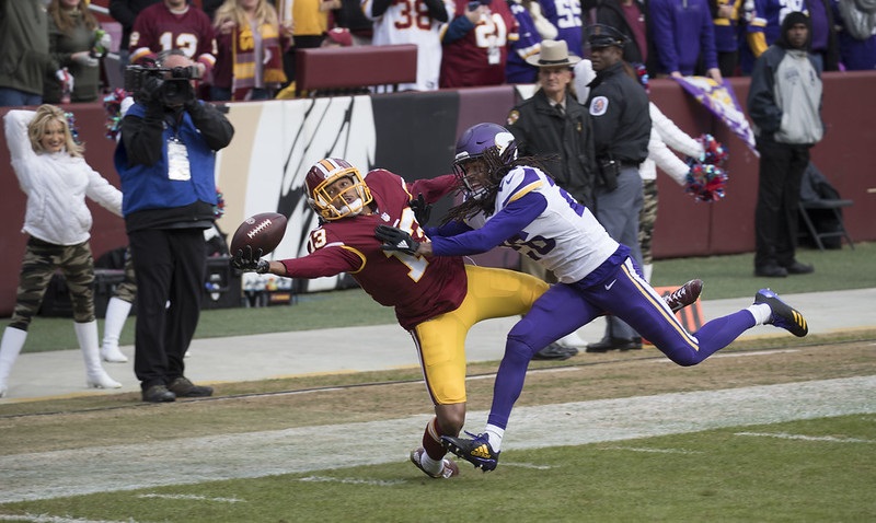 Photo of a touchdown catch in an NFL game between the Washington Redskins and Minnesota Vikings.