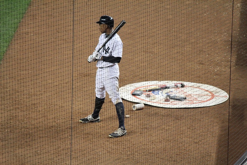 Photo of a New York Yankees player standing in the batter's box at Yankee Stadium.