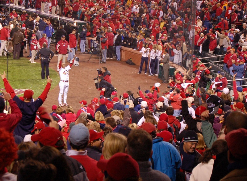 Photo of St. Louis Cardinals fans cheering at Busch Stadium.