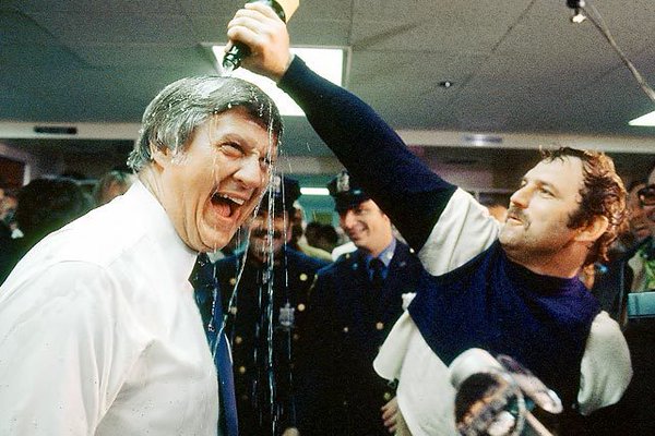 Photo of New York Yankees legend Thurman Munson celebrating the 1977 World Series Championship with Yankees owner George Steinbrenner. 