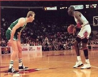 Photo of Michael Jordan vs. Larry Bird and the Boston Celtics at Chicago Stadium. 