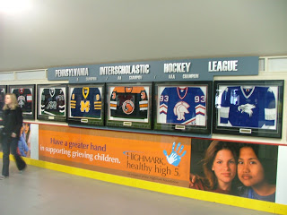 Photo of Pennsylvania High School hockey jerseys used to decorate the Civic Arena concourse.