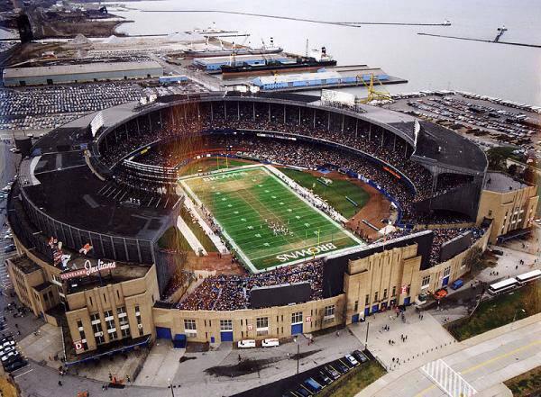 An aerial photo of Cleveland Municipal Stadium with Lake Erie in the background.