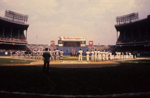 Photo of the Cleveland Municipal Stadium playing field from behind home plate during a Cleveland Indians home game. 