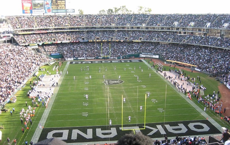 Photo of the playing field at Oakland Coliseum during an Oakland Raiders game.