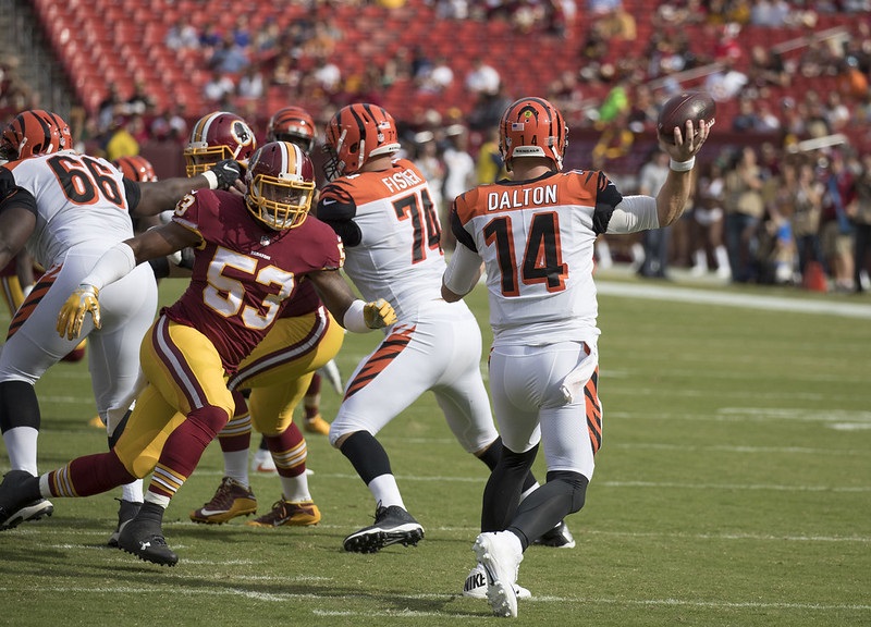 Photo of quarterback Andy Dalton of the Cincinnati Bengals completing a pass versus the Washington Redskins.