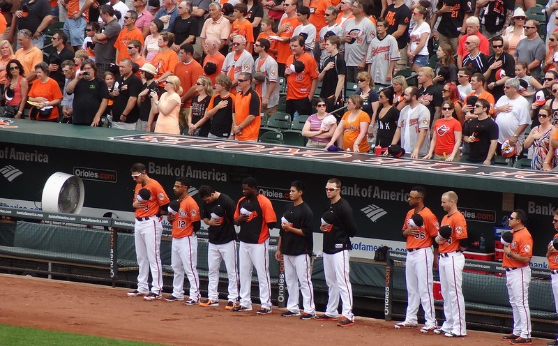 Photo of Baltimore Orioles players during the national anthem at Oriole Park at Camden Yards.