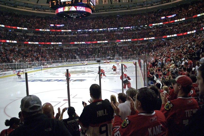 Photo of Chicago Blackhawks fans cheering at the United Center.