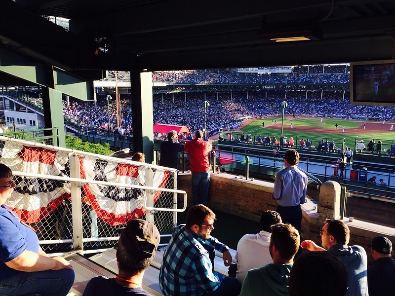 Photo of a Chicago Cubs home game at Wrigley Field from the Wrigleyville rooftops.