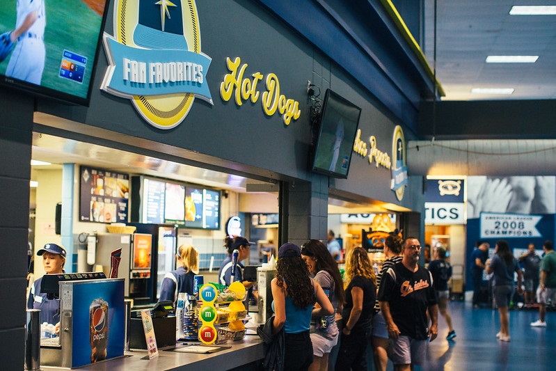 Photo of baseball fans at a concession stand at Tropicana Field during a Tampa Bay Rays game.
