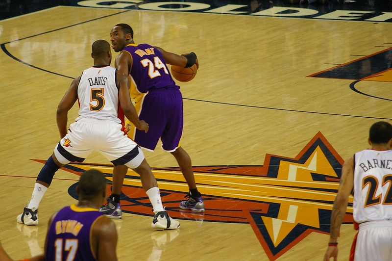 Photo of Kobe Bryant of the Los Angeles Lakers battling Baron Davis of the Golden State Warriors.