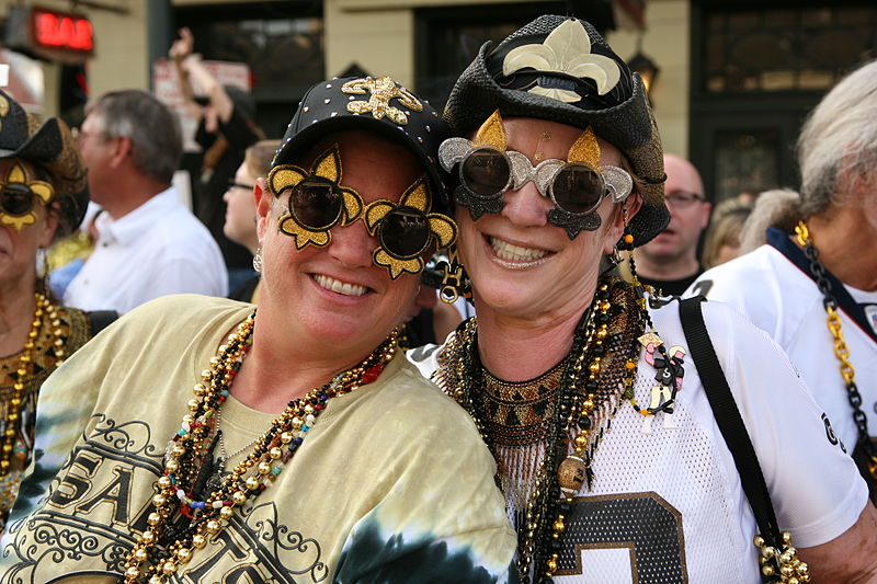Photo of New Orleans Saints fans celebrating on Bourbon Street in New Orleans, Louisiana.