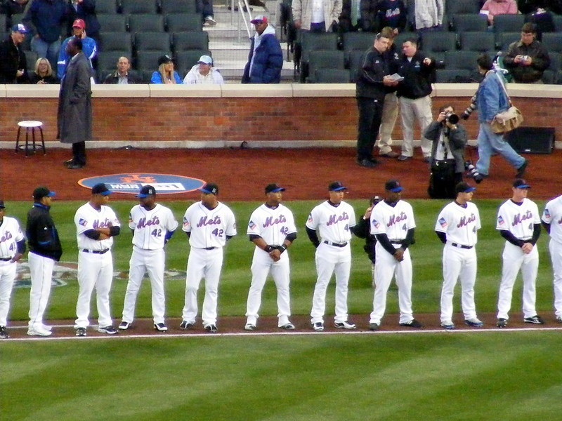 Photo of New York Mets players at Citi Field during the national anthem.