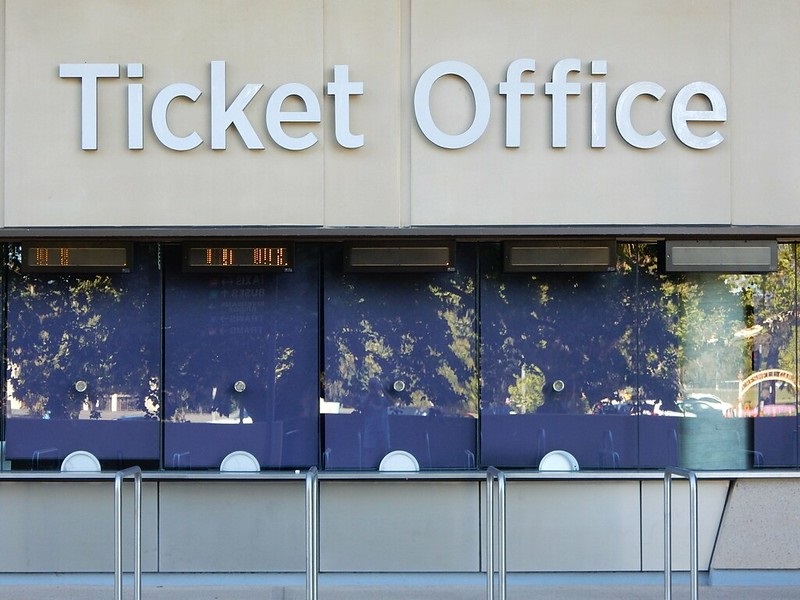 Stock photo of a ticket office outside of a large arena.