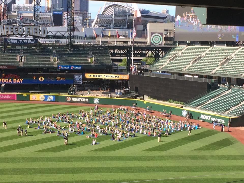 Photo of a yoga session at Safeco Field. Home of the Seattle Mariners.