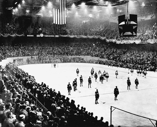 Black and white photo of the very first Boston Bruins home game at the Boston Garden.