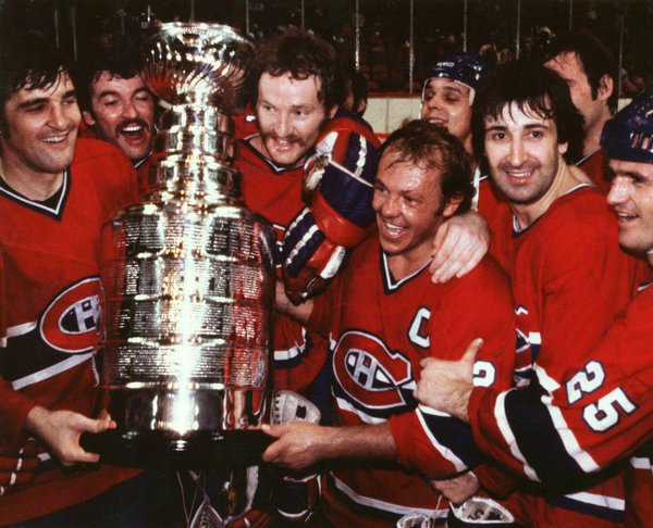 Old photo of the Montreal Canadiens celebrating one of their many Stanley Cup victories.