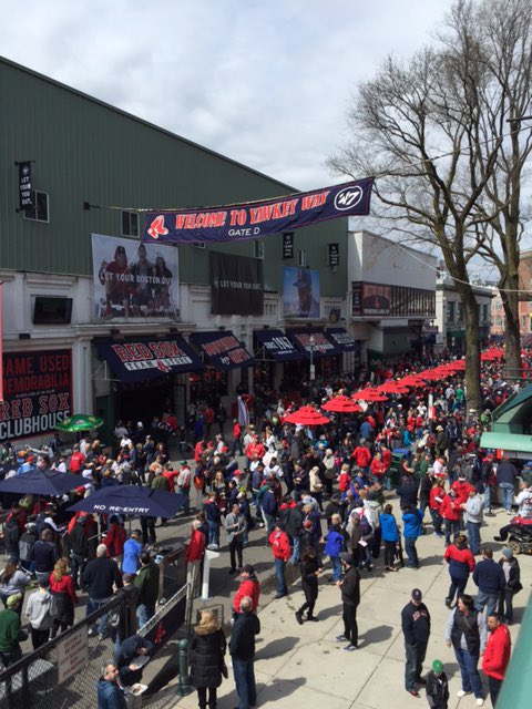 Photo of Boston Red Sox fans on the corner of Van Ness and Yawkey Way.