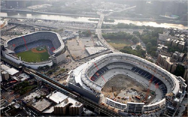 Photo of an aerial view of old Yankee Stadium and new Yankee Stadium side by side. 