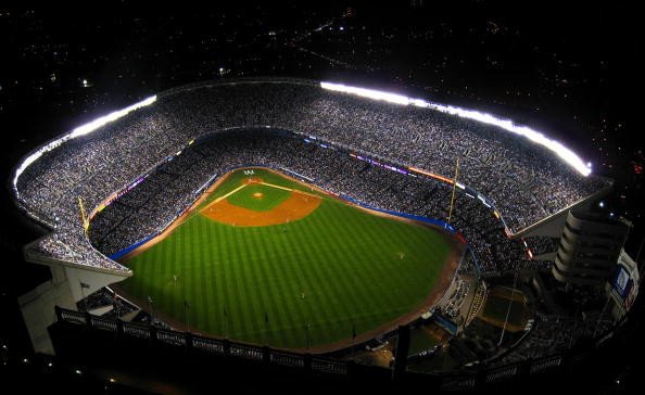 An aerial view of old Yankee Stadium during a night game. 