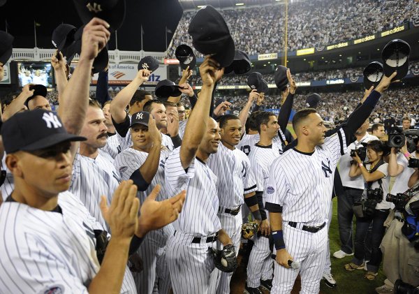 Photo of New York Yankees players saluting the Yankees fans following the final home game at old Yankee Stadium. 