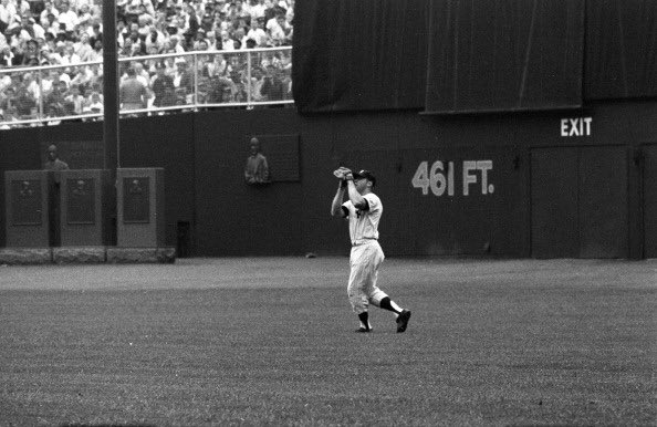 New York Yankees center fielder Mickey Mantle in action at old Yankee Stadium.