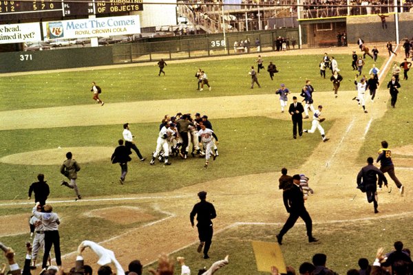 Photo of New York Mets fans rushing the field following Game 5 of the 1969 World Series.