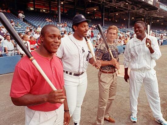 Photo of Detroit sports legends Barry Sanders, Cecil Fielder, Steve Yzerman and Joe Dumars at Tiger Stadium.
