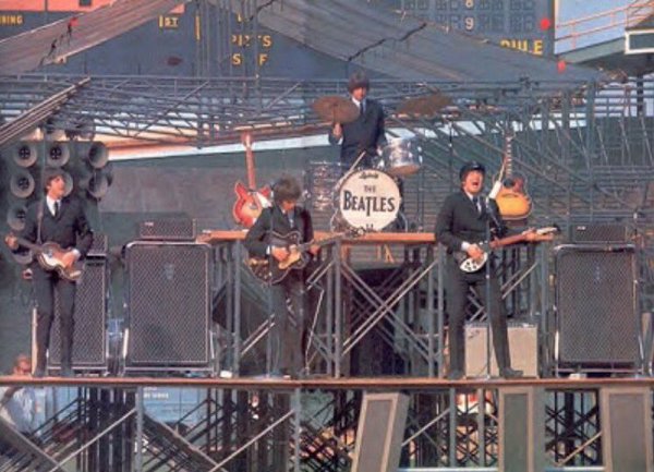 The Beatles performing at Comiskey Park in 1965.