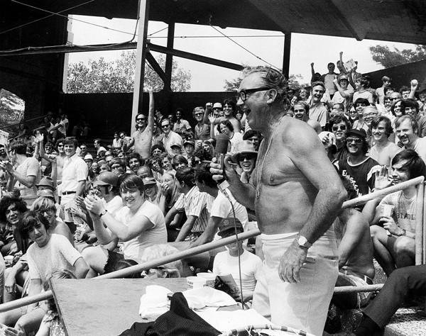 Former White Sox announcer Harry Caray broadcasting from Comiskey Park's outfield bleachers.